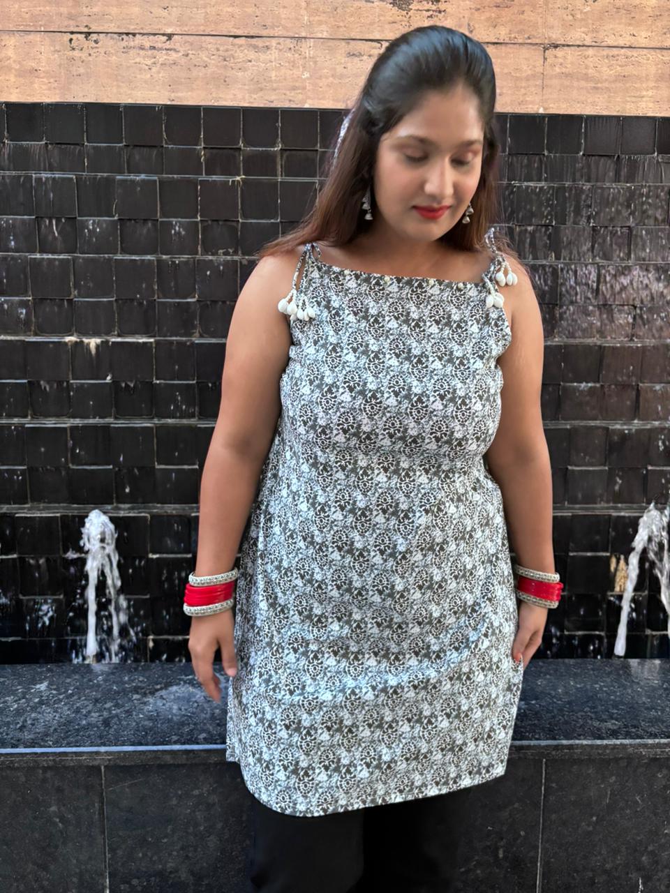 Noir Charm Tassel Kurti – Monochrome
Elegance